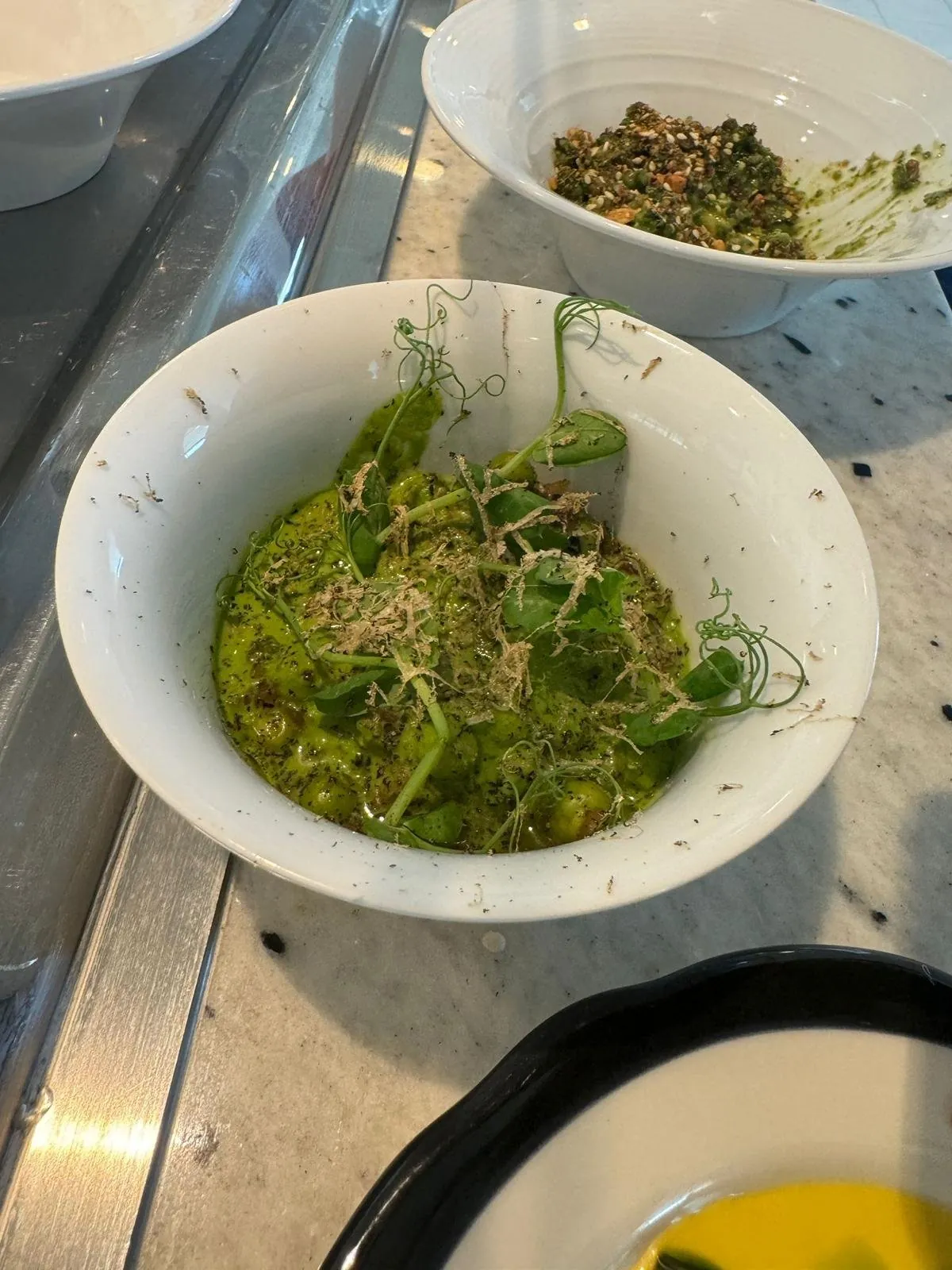 Green bowl with sprouts