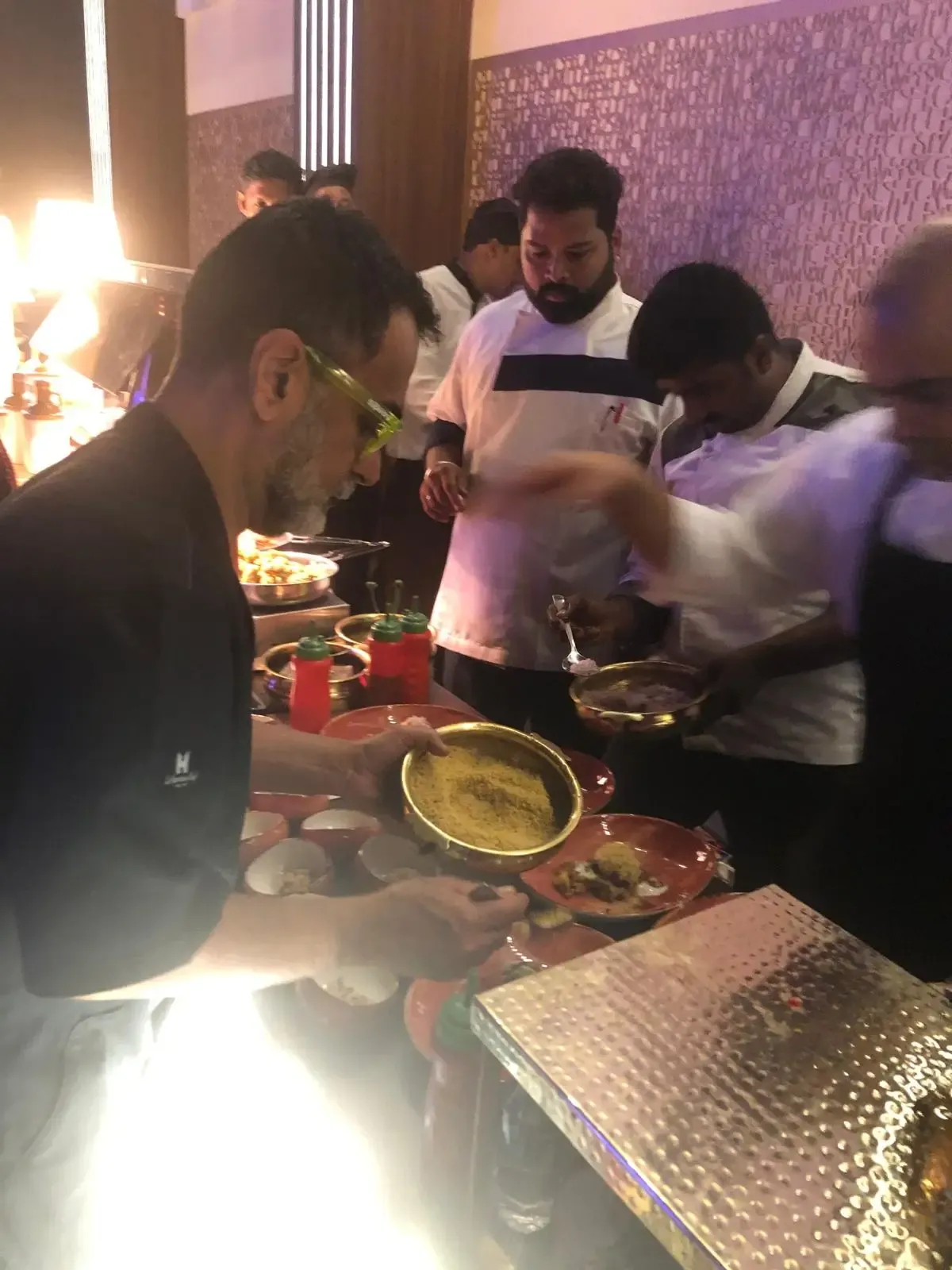 Chefs plating at a live station