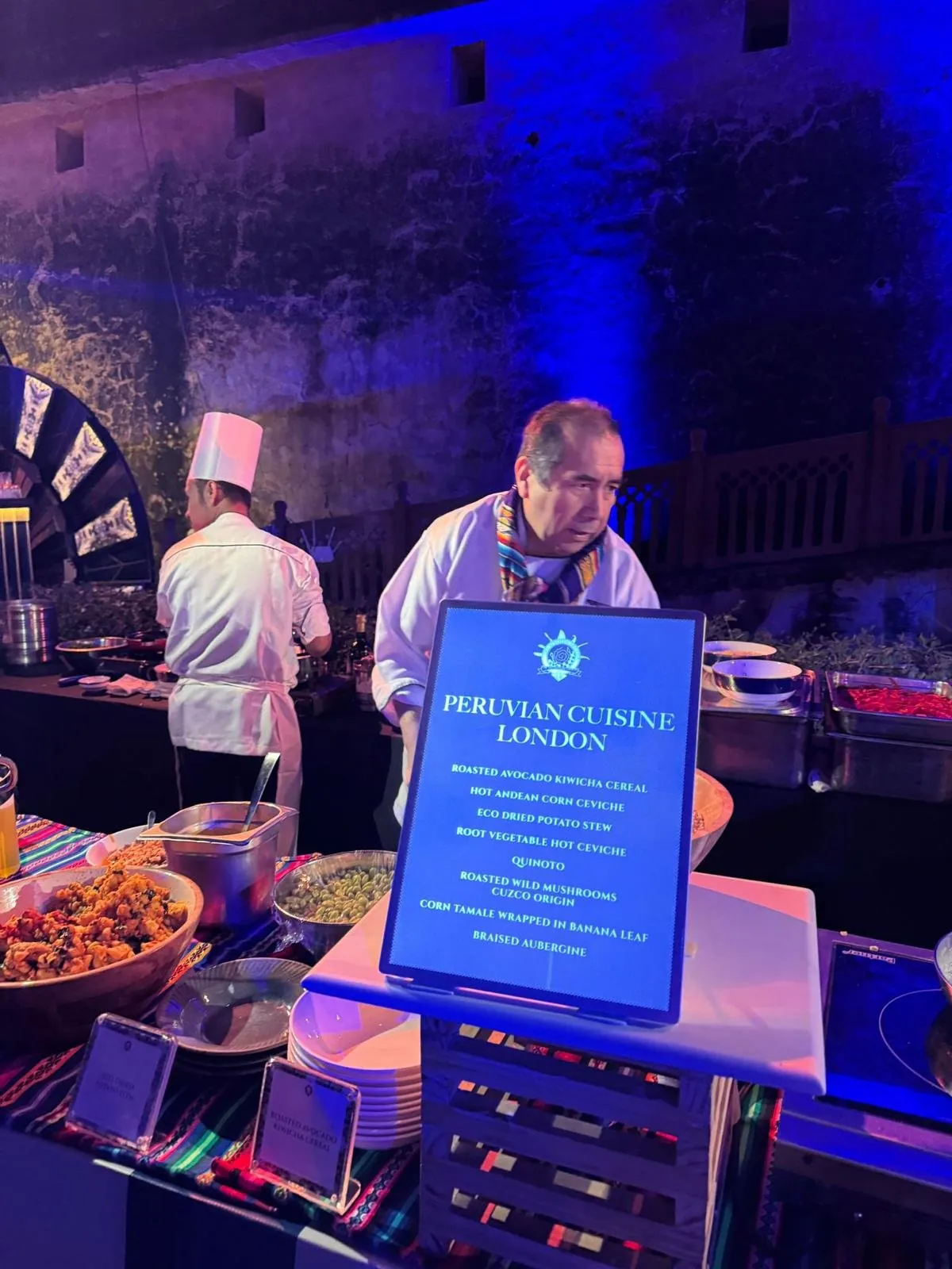 Chef at a Peruvian cuisine live station with its menu card