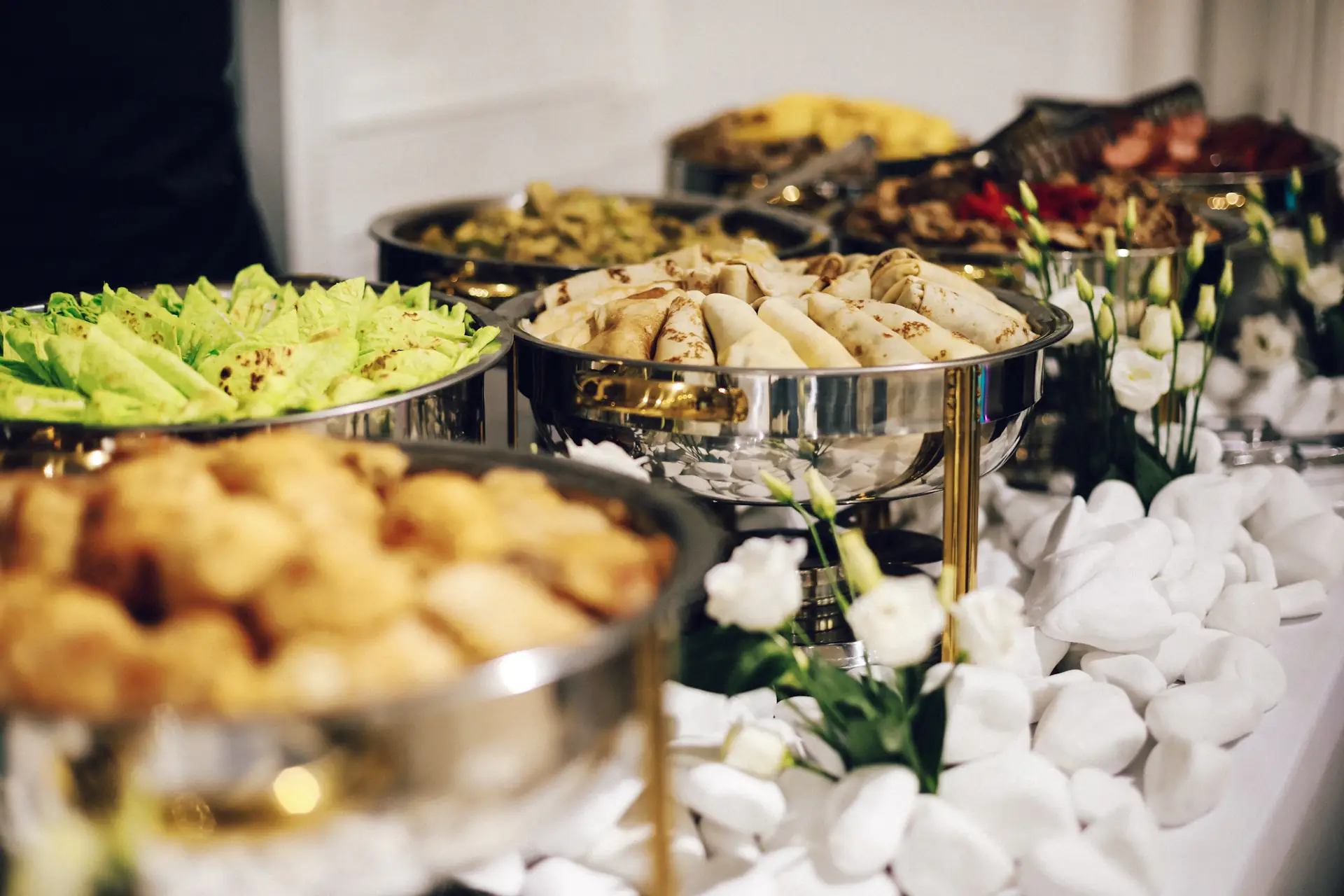 Silver chafing dishes on an elegant banquet buffet